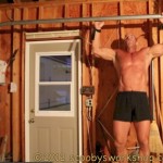home lat pullup workout on a garage door track